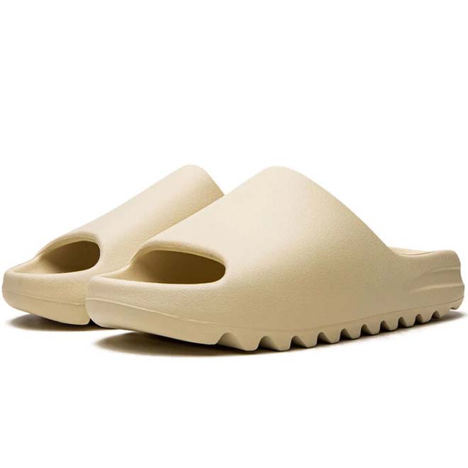 Adidas Yeezy Slide Bone zijkant design en vorm detail